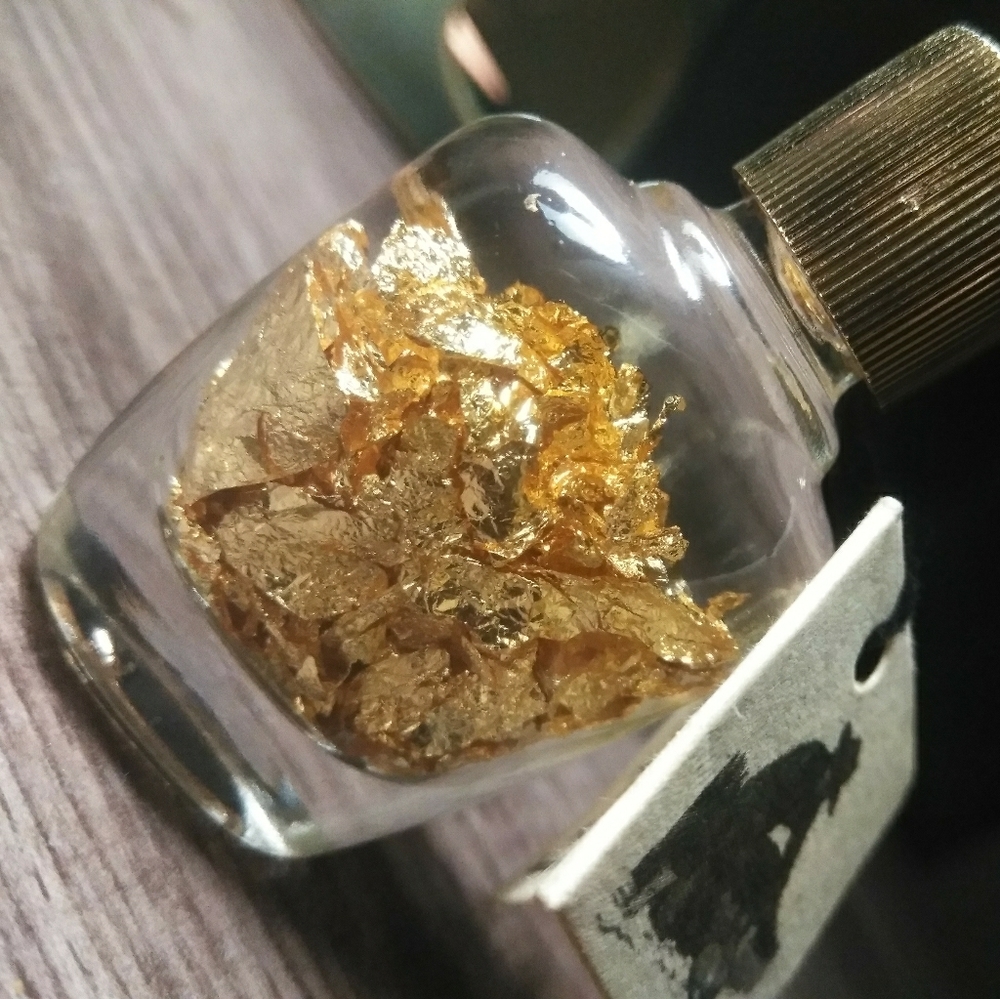 a tiny bottle of brazillian gold flakes